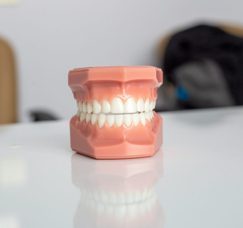 orange plastic container on white table